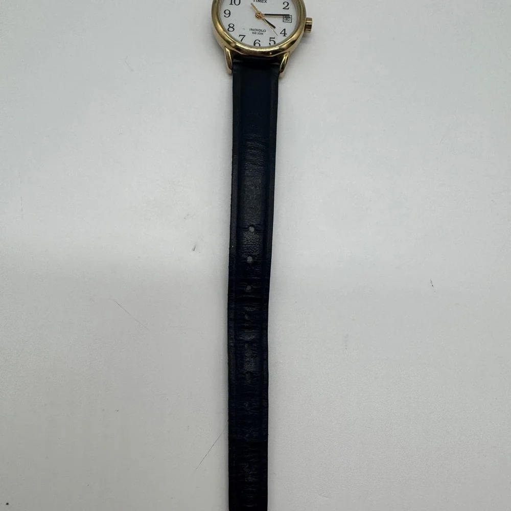 Timex Indiglo WR 30M Gold Tone White Dial Black Leather Watch CR 1216 needs bat